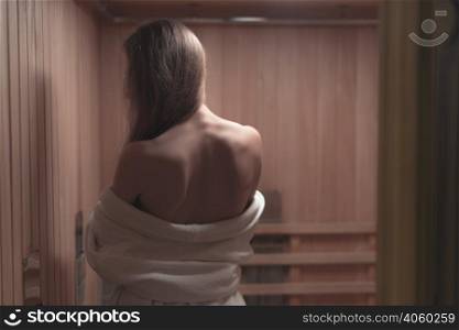 rear view backless sexy young woman sauna