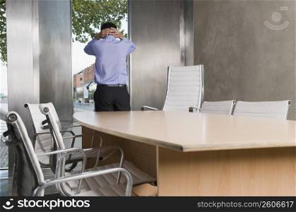Rear view of a businessman in a conference room