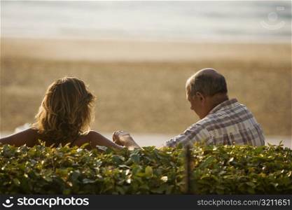 Rear view of a couple, Grande Plage, Biarritz, France