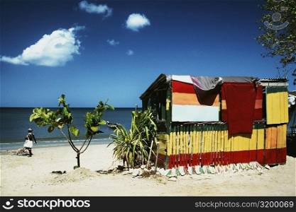 Rear view of a crude shelter on a calm beach, St. Lucia