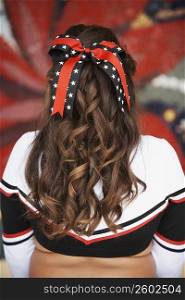 Rear view of a girl with a bow in her hair