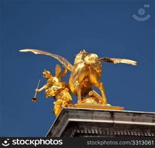 Rear view of a golden horse on Pont Alexandre in Paris - could be used for humorous reference