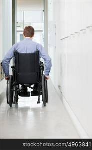 Rear view of a man in a wheelchair