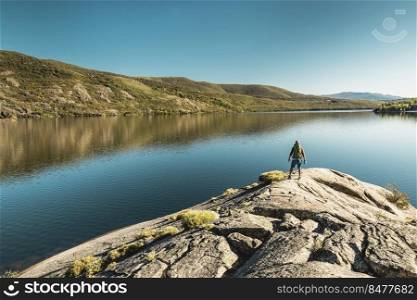 Rear view of a man near a beautiful lake 