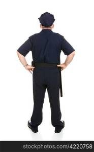 Rear view of a mature police officer in uniform. Full body isolated on white.