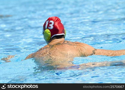 Rear view of a mid adult man in a swimming pool