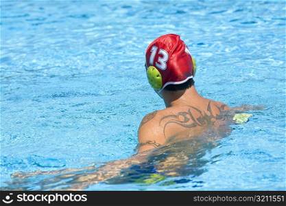 Rear view of a mid adult man in a swimming pool
