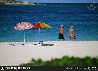 Rear view of a senior couple on a beach, Sunset & Nude Beach, Virgin Islands