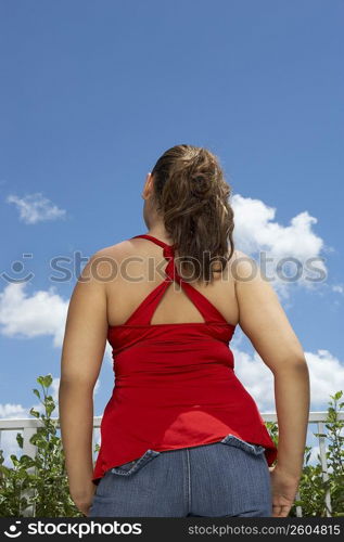 Rear view of a teenage girl standing
