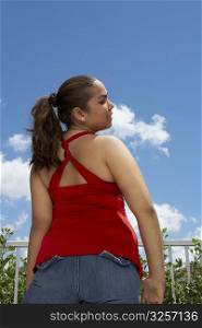 Rear view of a teenage girl standing