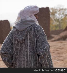 Rear view of a Tuareg man standing, Telouet, Ouarzazate, Souss-Massa-Draa, Morocco