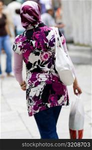 Rear view of a woman carrying shopping bags, Istanbul, Turkey