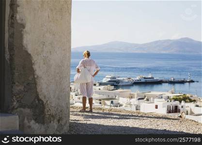 Rear view of a woman looking at a view, Mykonos, Cyclades Islands, Greece
