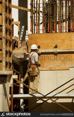Rear view of a worker at a construction site