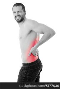 rear view of a young man holding his back in pain, isolated on white background