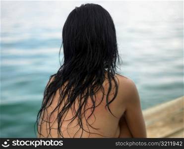 Rear view of a young woman sitting