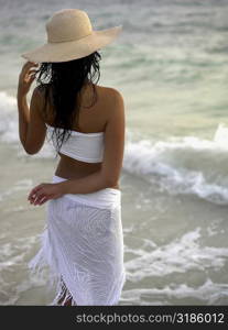 Rear view of a young woman wearing a sun hat