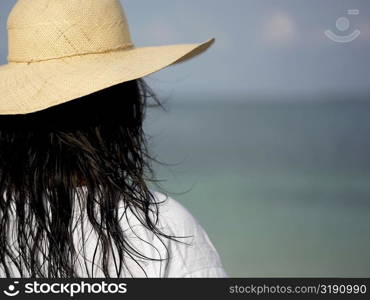 Rear view of a young woman wearing a sun hat