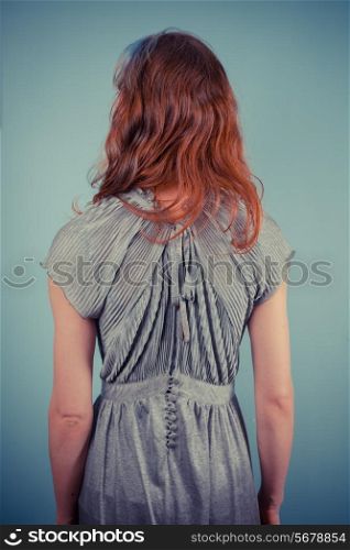 Rear view of a young woman wearing an evening dress