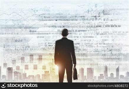 Rear view of businessman looking at business marketing strategy. Graphics and business strategy