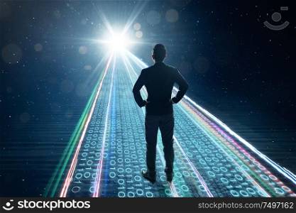 Rear view of businessman standing on binary code numbers on motion lighting road , speed and faster digital matrix business technology information concept .