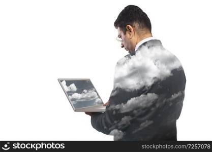 Rear view of  businessman working on laptop computer with shades of clouds