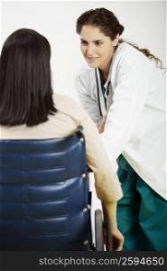 Rear view of female patient talking to a female doctor