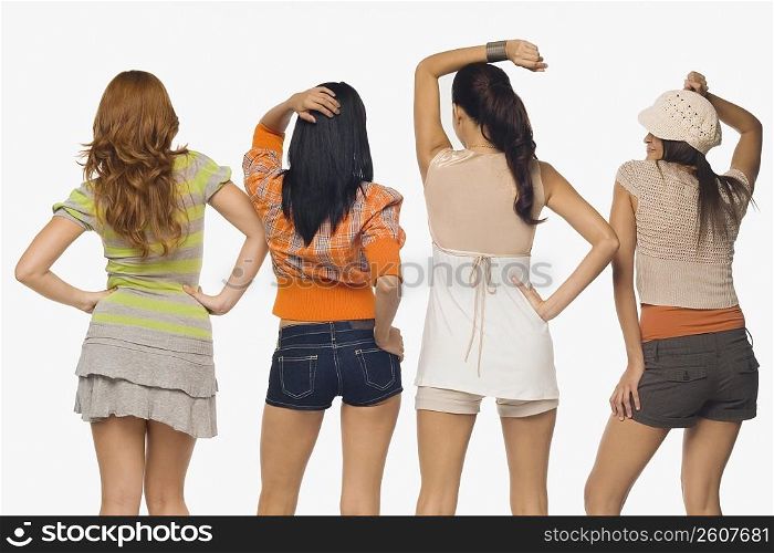Rear view of four young women posing