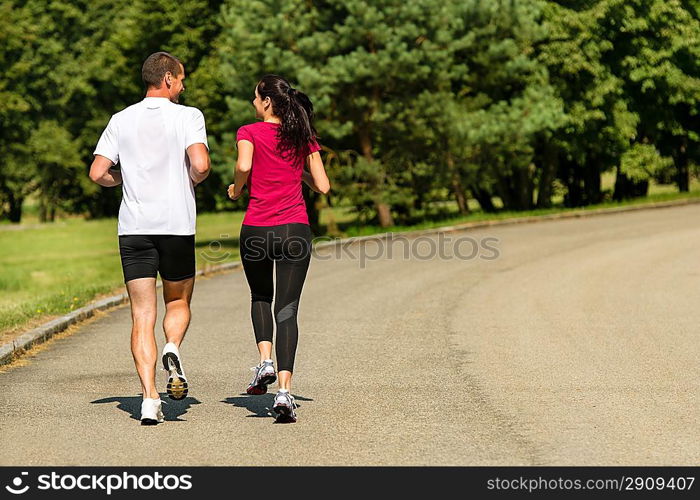 Rear view of jogging Caucasian couple outdoors