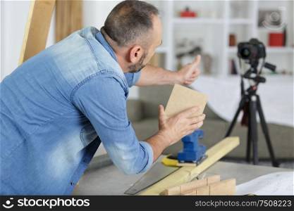 rear view of man making carpentry blog