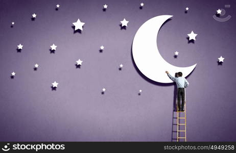 Rear view of man standing on ladder and reaching moon. Reaching the moon
