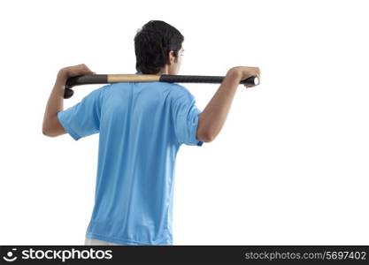 Rear view of man with hockey stick isolated over white background