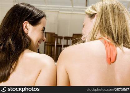 Rear view of two young women