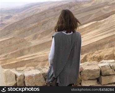 Rear view of woman in desert, Scorpions Ascent, Arava Valley, Negev Desert, Israel