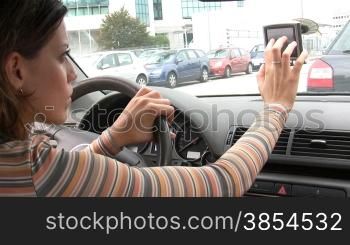 Rear view of woman typing on global positioning system. 30fps