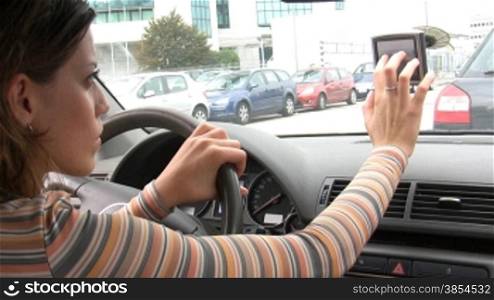 Rear view of woman typing on global positioning system. 30fps