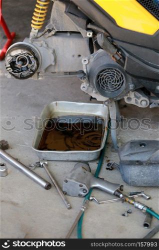 Rear wheel of a motorcycle in repair of the damage,Garage shop.