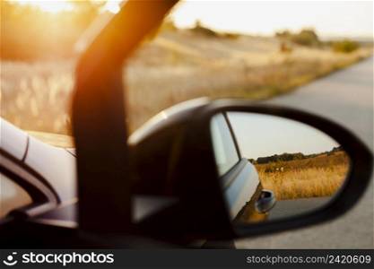 rearview mirror sunset background