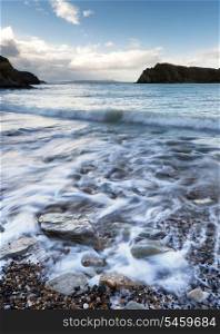 Receding waves on beach landscape long exposure