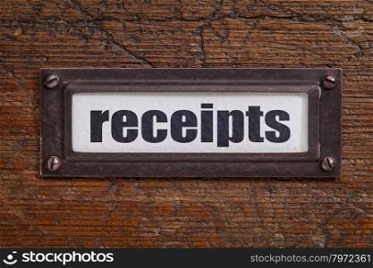 receipts - a label on a grunge wooden file cabinet - accounting or bookkeeping concept
