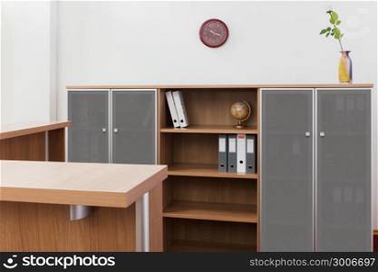 reception desk and bookcase in a modern office