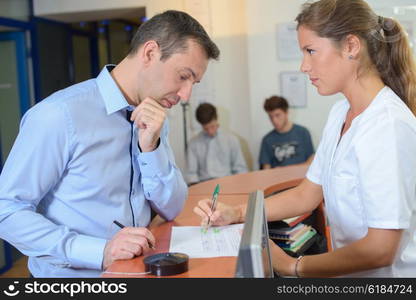 Receptionist explaining to client