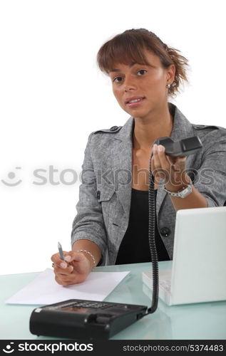 Receptionist handing over telephone hand set