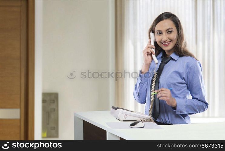 Receptionist talking on phone