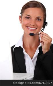 Receptionist with headset and computer