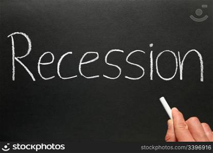 Recession written in chalk on a blackboard.