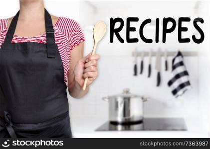 Recipes cook holding wooden spoon background.. Recipes cook holding wooden spoon background