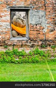 Reclining buddha in window frame