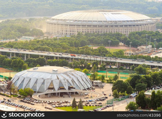 Reconstruction of Luzhniki Stadium and Druzhba Multipurpose Arena for soccer world cup 2018 in Luzhniki, Moscow. Bridge Luzhniki, transportation, heavy traffic, cars, parking spaces. View from above.