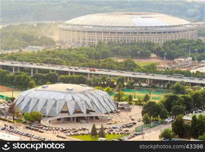 Reconstruction of Luzhniki Stadium and Druzhba Multipurpose Arena for soccer world cup 2018 in Luzhniki, Moscow. Bridge Luzhniki, transportation, heavy traffic, cars, parking spaces. View from above.